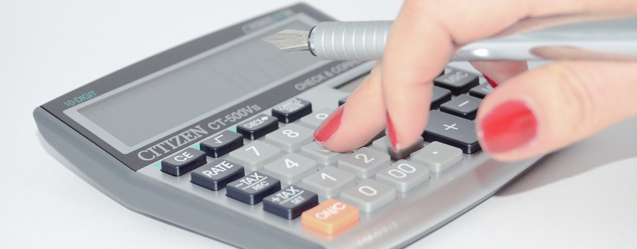 A girl who knows How to computer Holiday Pay with her calculator.