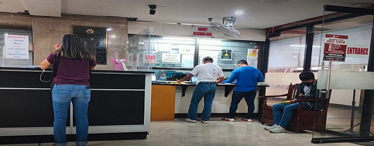 Busy people paying Small Claims Philippines to the cashier