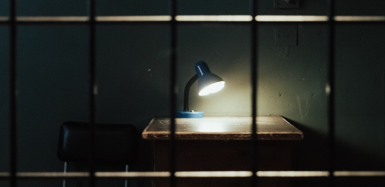 A lamp inside a dark room symbolizing invalid Transfer of Employee in the Philippines and Illegal Dismissal