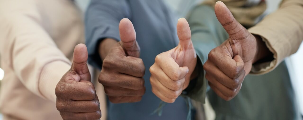 Thumbs up symbolizing non-prejudicial transfer of employee in the Philippines.