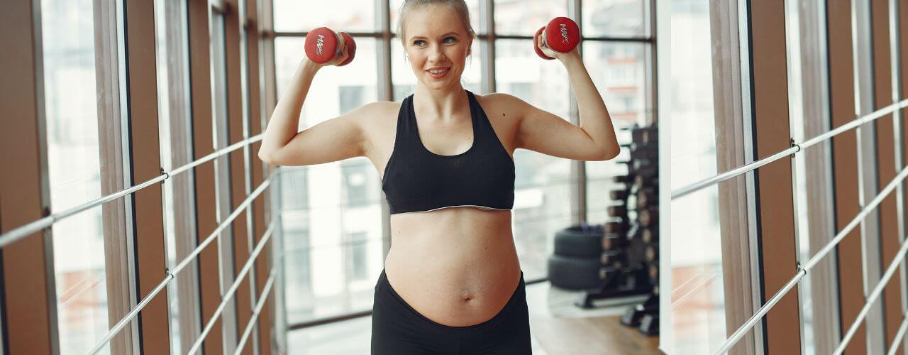 A pregnant woman in the gym symbolizing Maternity Leave Philippines.