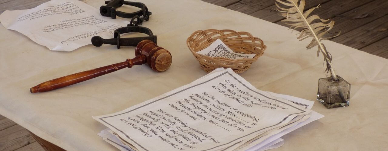 Documents and gavel on the table symbolizing court requirements for reissuance of lost certificate of title