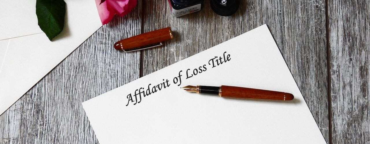 A pen and paper for making affidavit of lost certificate of title